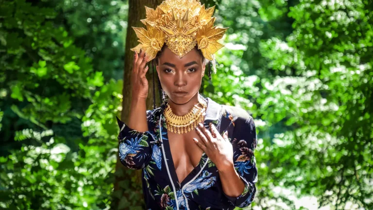Three models in sculptural African-inspired styling represent equality and shared growth