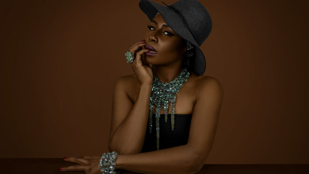 Gypsy Queens Editorial. Black model wearing a grey hat and turquoise Konplott jewelry