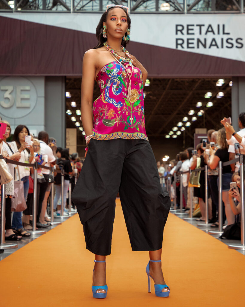 New york fashion in summer – bold patterned top and baggy pants runway look.