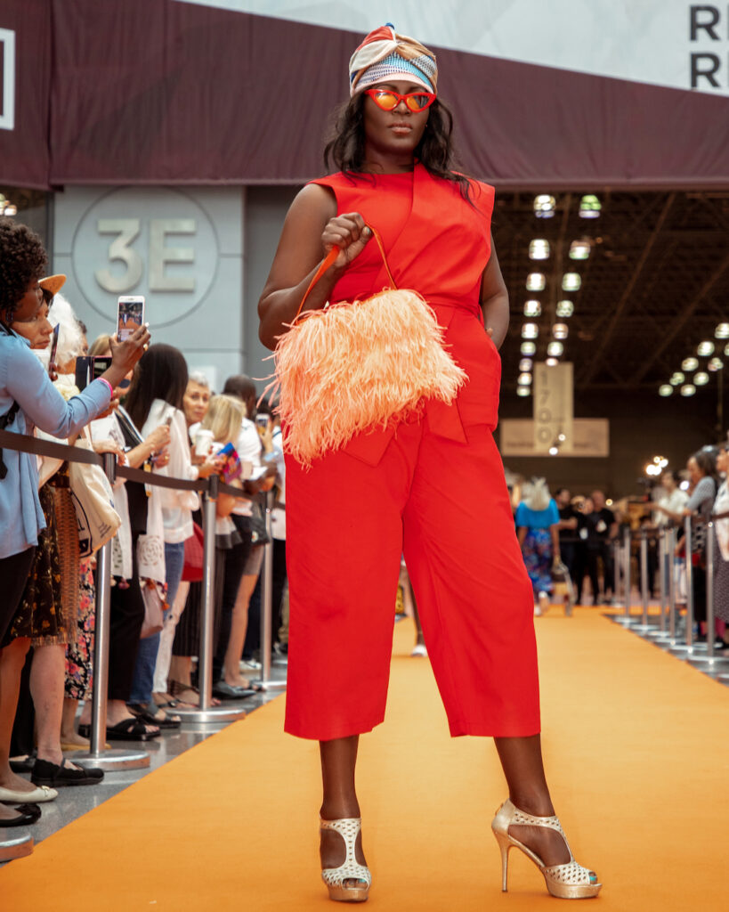New york fashion in summer – orange summer dress runway.