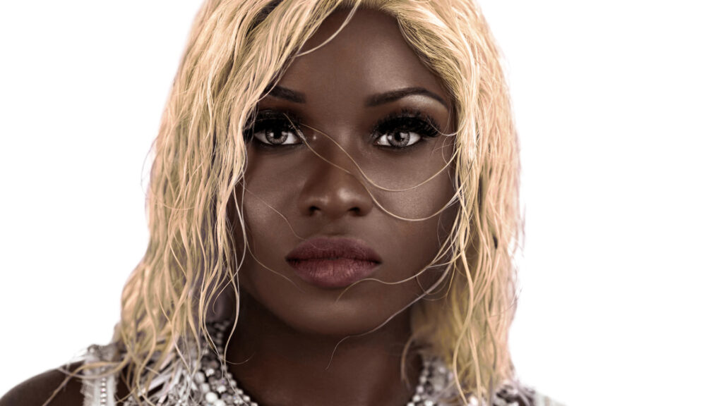 Headshot of a sensual Black woman with blonde hair and silver-white jewelry in a studio.