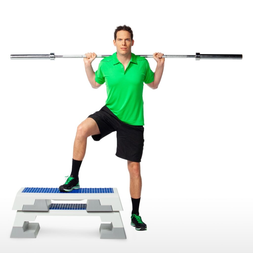 Tennis player using free weights as part of Weight Training For Tennis