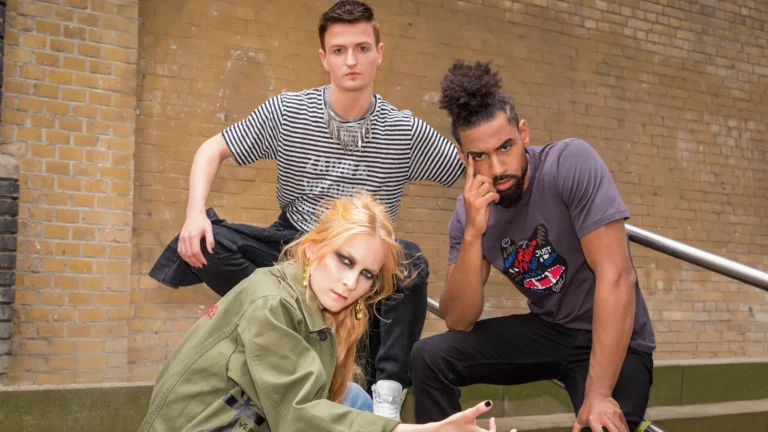 Three models in Zadig & Voltaire looks against a brick wall in Berlin