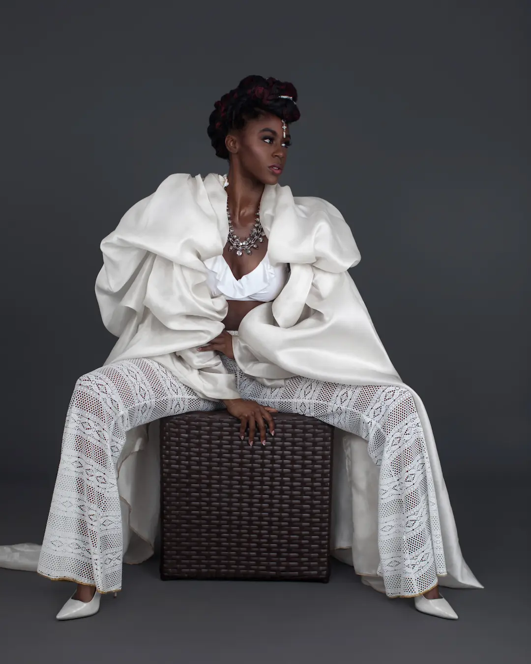 Fashion model in a studio editorial representing teamwork and professional standards