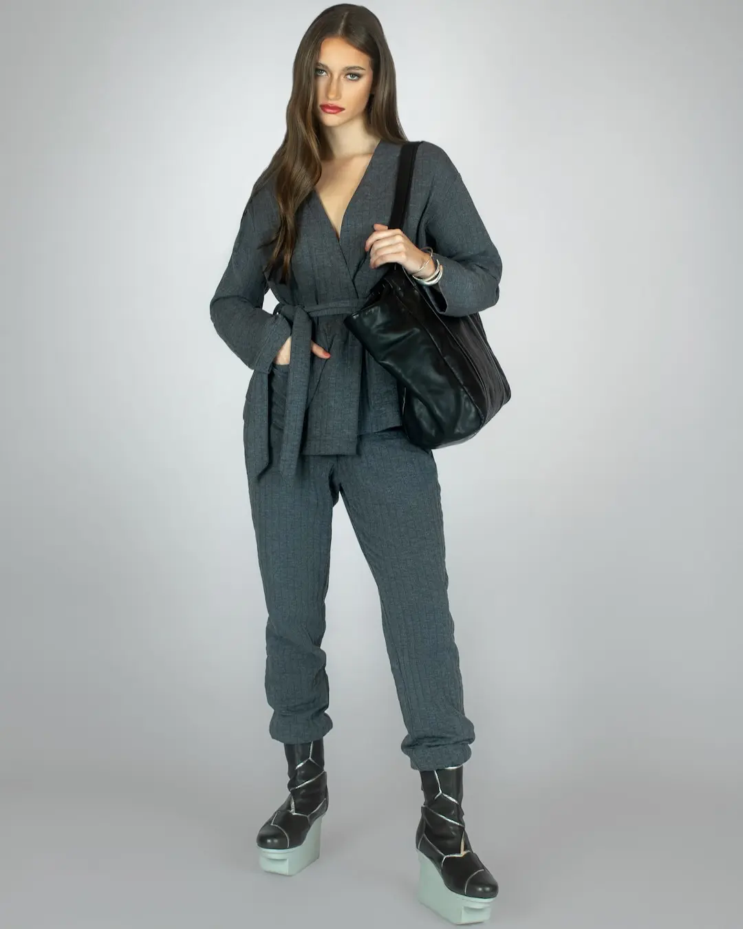 Grey Triumph suit with black Trippen shoes in a mild winter fashion editorial