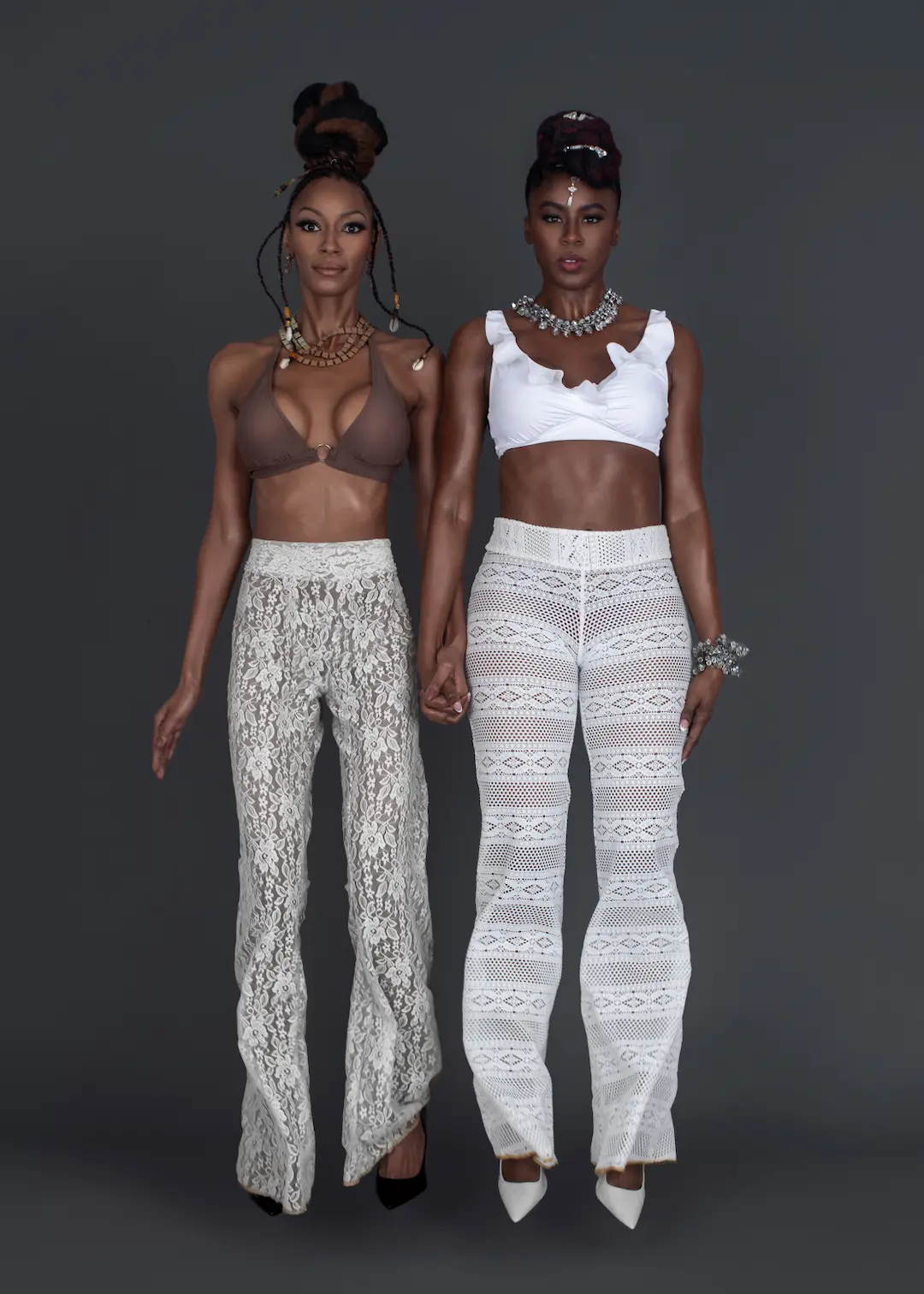 Two fashion models seated together, representing shared goals and accountability