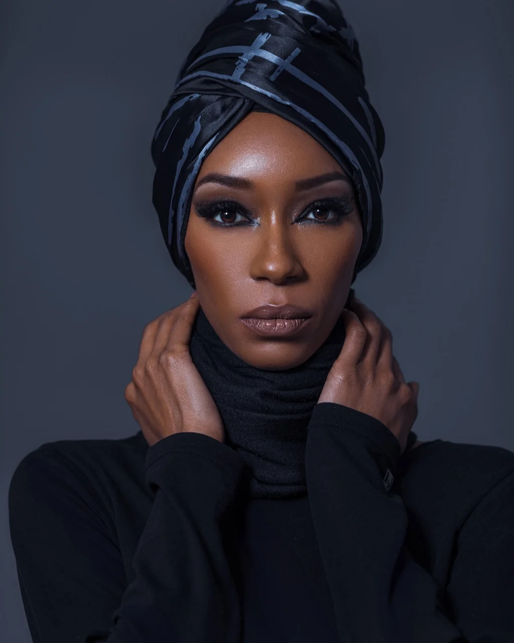 Black woman in a sculptural head wrap illustrating inclusive fashion visual storytelling