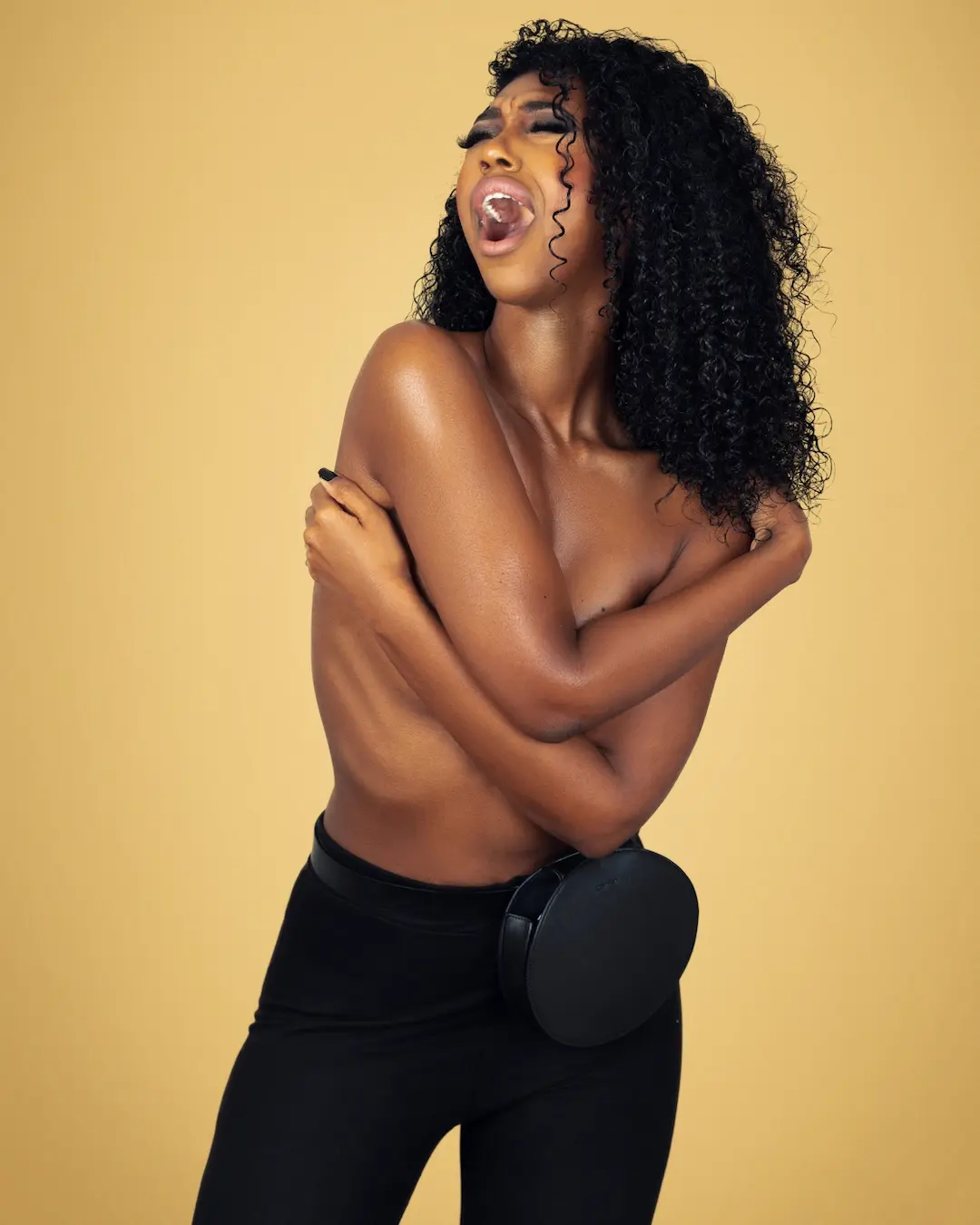 Expressive Black woman posing for a melanated pride fashion portrait