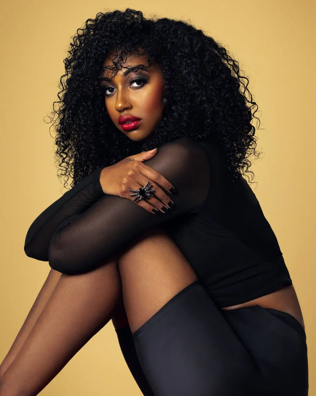 Melanin beauty portrait with expressive styling and jewelry