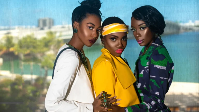 Pérez Art Museum Miami fashion editorial: three models in white, yellow and green looks against Biscayne Bay