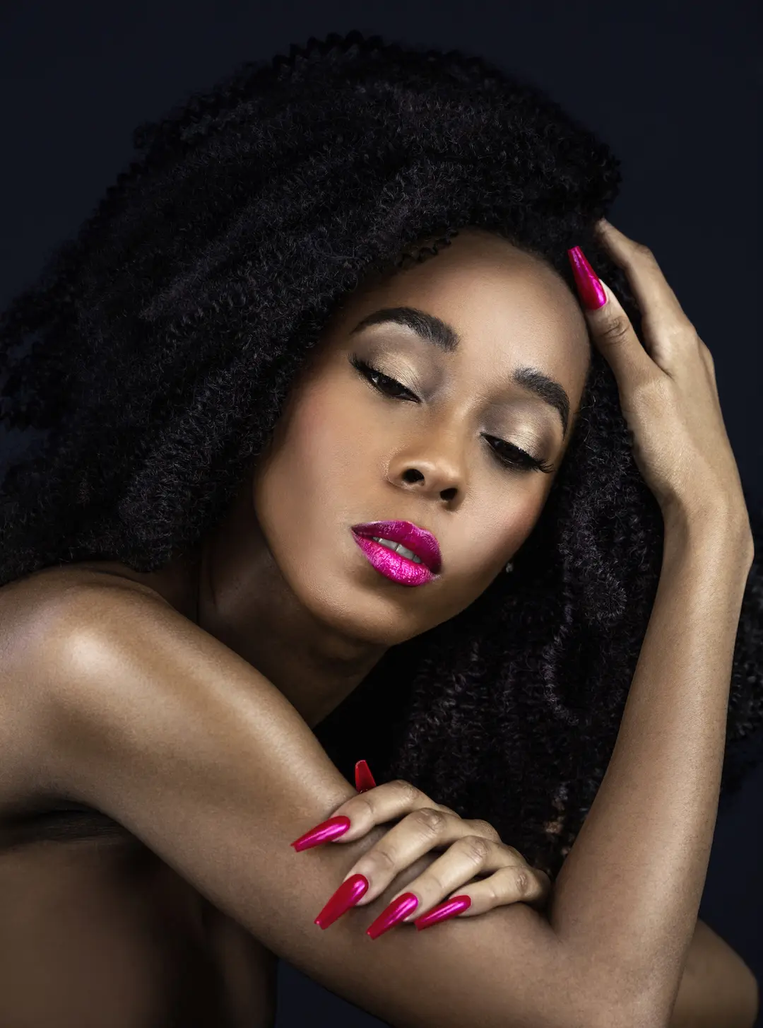 Quiet luxury beauty look with dark curls and precise fuchsia makeup
