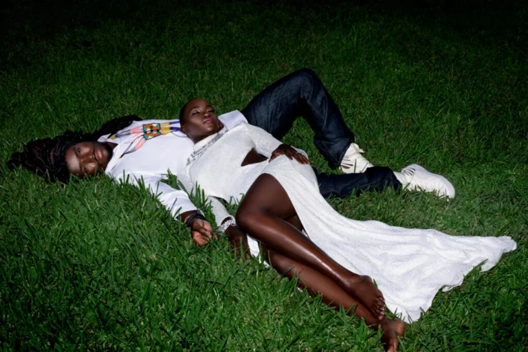 Commercial fashion photography team posing outdoors during a campaign production